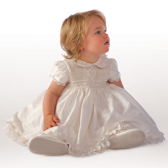 Ivory silk christening dress with beautiful hand smocking and embroidered rosebuds with matching bloomers and bonnet