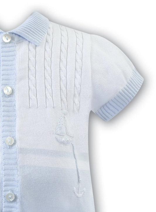 pale blue and white knitted short sleeve short leg romper for boys with hand embroidered boat and anchor.